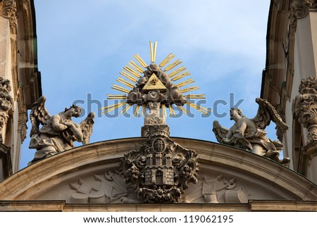 The Trinity Symbol between two angels and Buda's Coat of Arms in Tympanum of Baroque, 18th century Saint Anne Church in Budapest, Hungary.