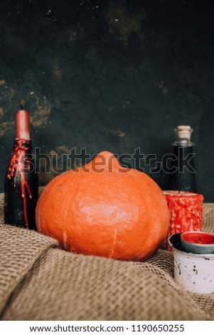  Halloween background. Molten candles. Carrying out the ritual.  Halloween in rustic style. Autumn mood. All hallows' day. Pumpkin, lamp, candles. Harvest. Countryside. 