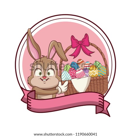 Rabbit with easter eggs in basket