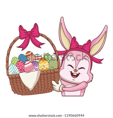Rabbit with easter eggs in basket