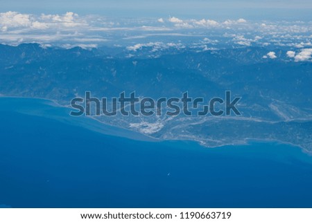 Picture of Mountains, rivers, oceans and cities taken from the plane.