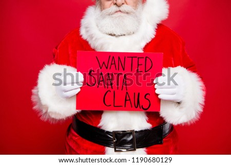 Holly jolly x mass concept. Cropped close up photo of confident calm aged mature stylish Santa in tradition costume with crime placard in white hands stand isolated on red bright background