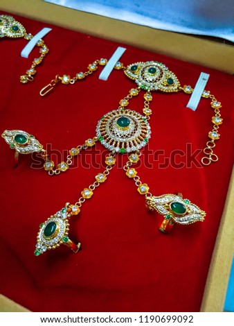 It is called "hathphul." It is worn on hand, especially worn in Indian weddings.