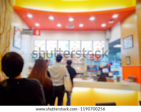 It's a blurred picture of people are line up for order fast food. Fast food concept. Junk food. Royalty-Free Stock Photo #1190700256