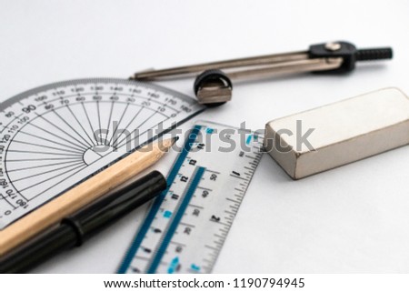 Maths Equipment, Protractor, Compass, Pen, Pencil, Ruler, Rubber/Eraser, Paper, on white background