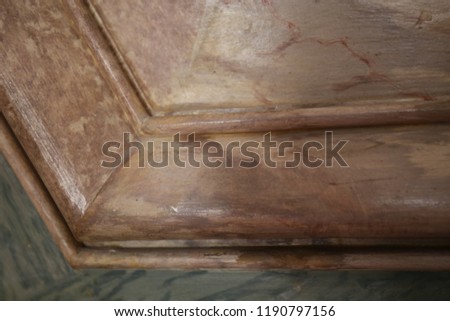 Close up view of ancient decorative elements made of pink and brown marble. Borders and corners with geometric lines and bright surfaces. Abstract textured colorful picture. Ornament wall detail. 
