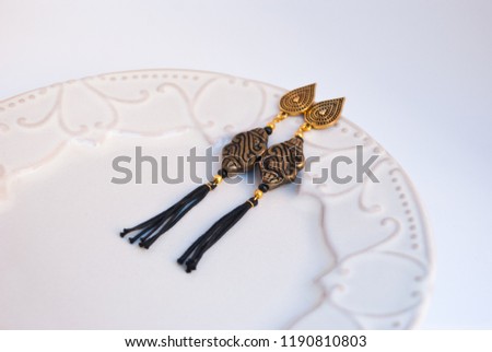 Beautiful gold and black tassel dangle earrings in bohemian style.Indian, turkish fashion ijewelry.