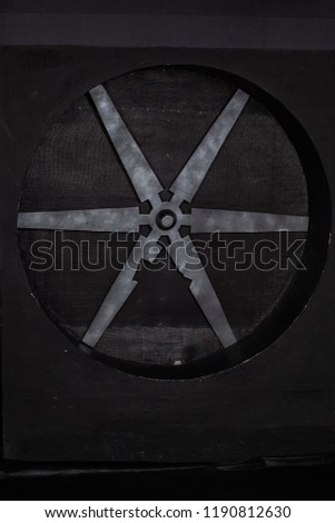 decorative design: black circle with metal blades