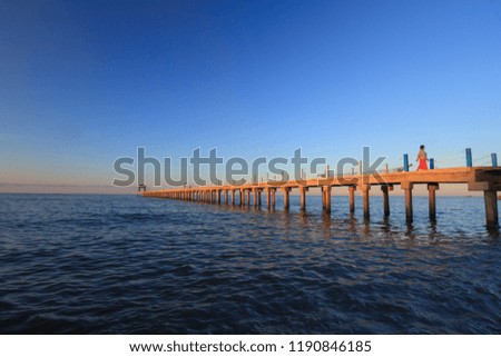 Bridge and Sea after sunset Royalty-Free Stock Photo #1190846185