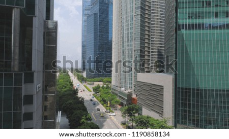 Financial and business centers in asian. Shot. Top View of Skyscrapers in a Big City with development buildings, transportation, energy power infrastructure
