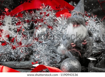 New Year's and Christmas with a Santa doll on the background of decor and ornaments