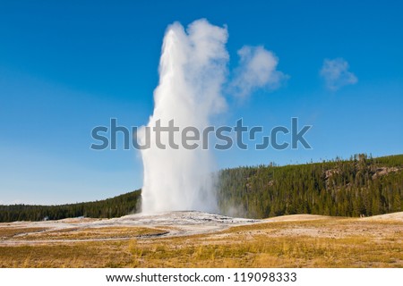 Eruption of Old Faithful geyser at Yellowstone National Park Royalty-Free Stock Photo #119098333