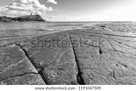 The famous dolomitic limestone ledges on the beach at Kimmeridge Bay on Dorset's Jurassic Coast. A high contrast monochrome edit. 