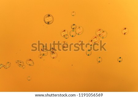Soap bubbles on a golden background