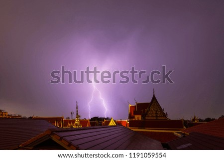 Lightning is a white line on the roof of the temple. Both beauty and fear because the lightning is dangerous.