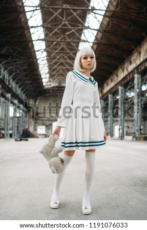 Cute style blonde woman with toy bear