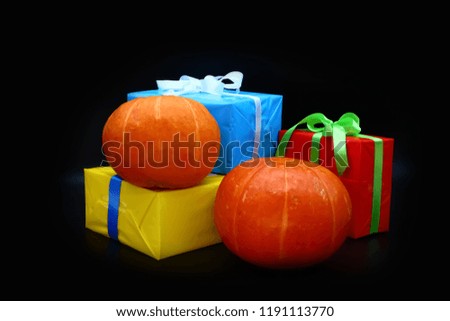pumpkin and gifts on a dark background