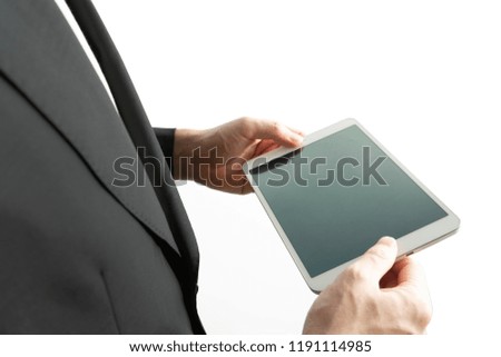 Business man use of mobile phone and tablet on white background