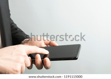 Business man use of mobile phone and tablet on white background