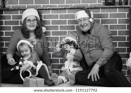 Santa Claus couple with kids Christmas tree
