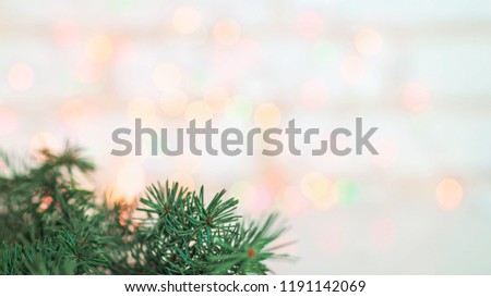 Christmas card live tree on a background of colorful lights bokeh gentle photo place for an inscription