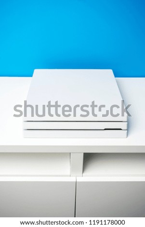 White game console lying on the table