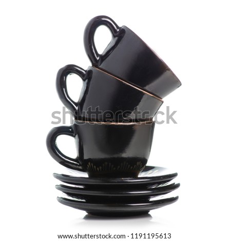 Black coffee cups and saucers on a white background isolation