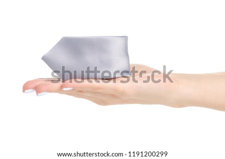 Male gray tie in hand on white background isolation