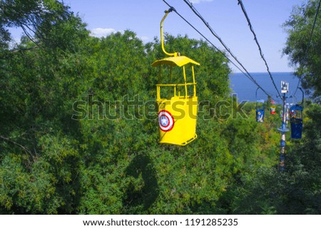 Cableway cabines on a forest backdrop. Travel background. Funicular.