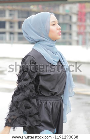 Asian girl wearing hijab at outdoor photoshoot session 