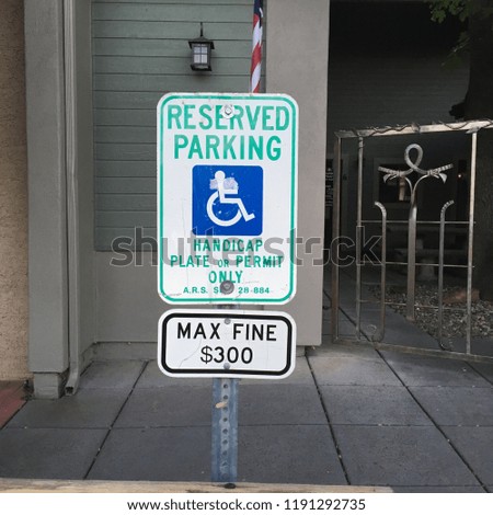 Reserved parking handicap sign with wheelchair symbol