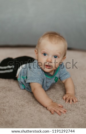 Adorably Cute Little Baby Boy Having Fun During a Photoshoot