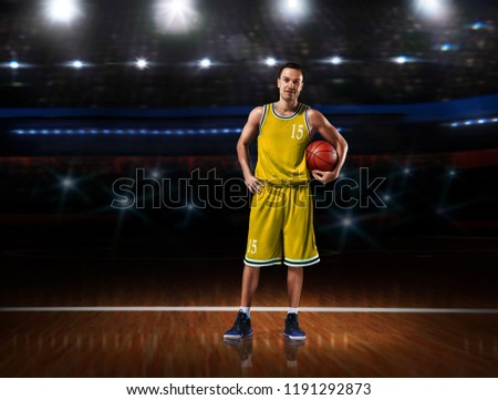 basketball player in yellow uniform standing on basketball court