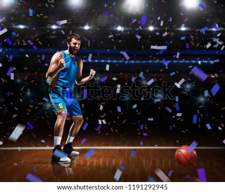 basketball player celebrating victory on basketball arena