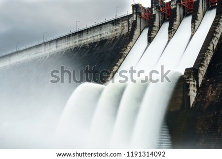 Water spills over the top of Dam
