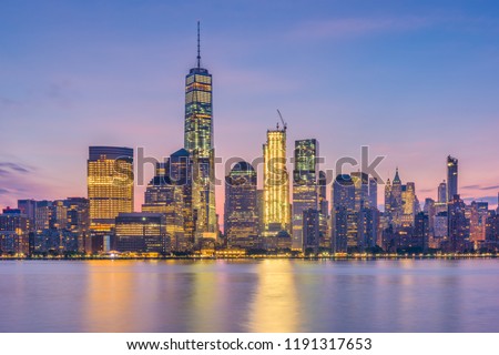 New York, Lower Manhattan Skyline from across the Hudson River at dawn.