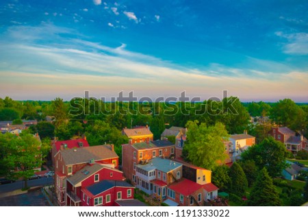 Aerial view of suburban houses on sunset sky background with warm sunrise on summer. - West Chester, Pennsylvania USA Royalty-Free Stock Photo #1191333022