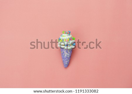Table top view shot of arrangement food object background concept.Flat lay of sweet ice cream cone on the modern rustic pink paper at home office desk wallpaper.Beautiful pastel tone creative design.