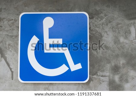 Blue and white sign for handicapped access. 