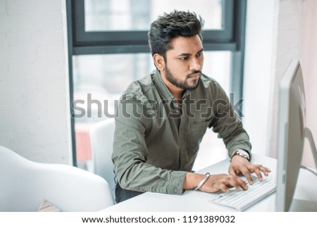 creative man with pc computer working at modern office