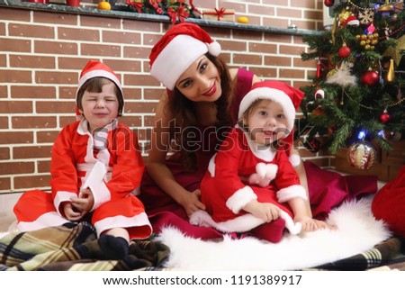 Santa Claus couple with kids Christmas tree