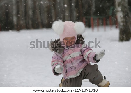 Children walk in the park in winter. Winter forest family with children on a walk. A cold winter day is a family walk.

