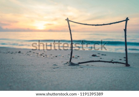 Photo frame on sand beach morning time.
