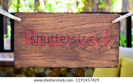 Reserved text on a wooden signboard