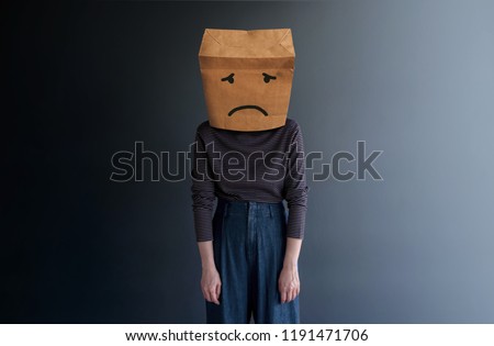 Customer Experience or Human Emotional Concept. Woman Covered her Face by Paper Bag and present Sad Feeling by Drawn Line Cartoon and Body Language Royalty-Free Stock Photo #1191471706