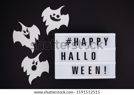 Lightbox with the text Happy Halloween. Flat lay of accessory decoration Halloween festival background concept. 