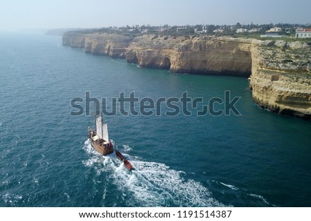 beautiful turquoise ocean water with boat on it top view aerial photo Royalty-Free Stock Photo #1191514387