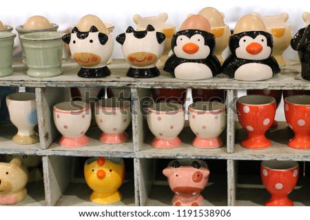 .Traditional ceramic animal glass pottery standing on the shelve in Thailand,have cow,penguin,duck and pic glass.