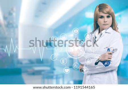 Female doctor with stethoscope in hand and icon medical network .Medical technology concept