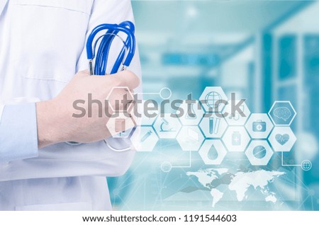 Male doctor with stethoscope in hand and icon medical network .Medical technology concept